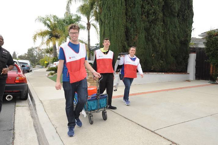 Volunteers walk down street